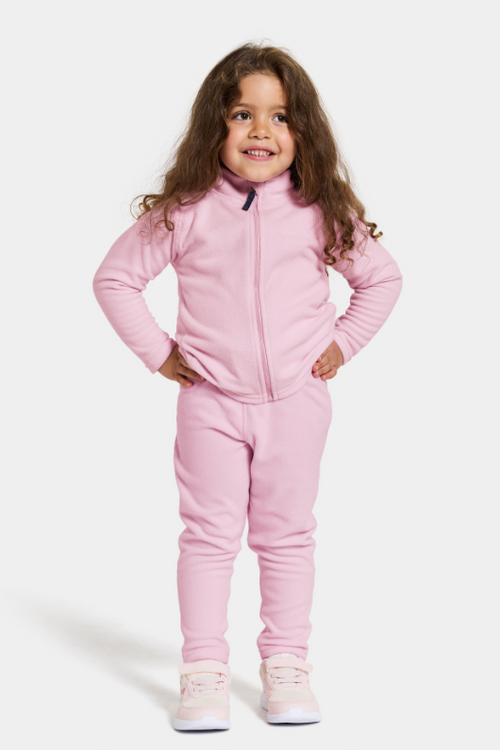 Didriksons Monte Jacket. A girls mid-layer jacket in pink with zip fastening, chin guard, and a thermal fleece finish