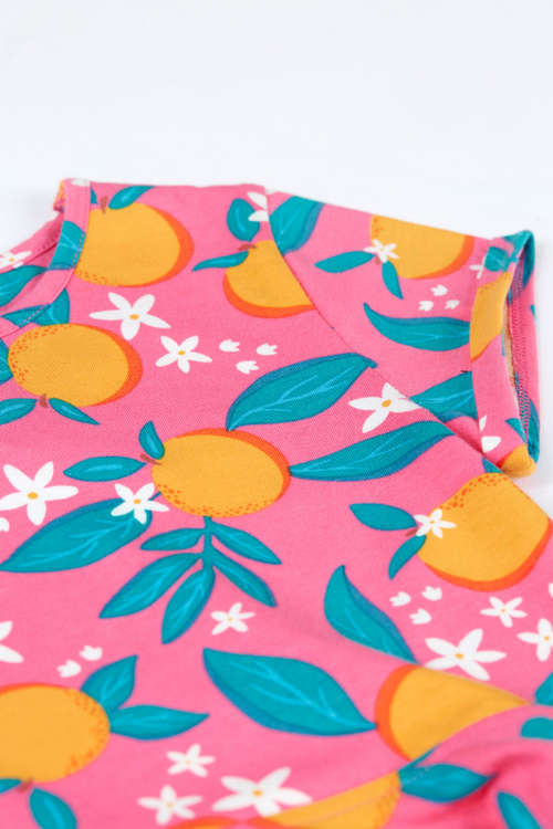 Frugi Summer Skater Dress. A short sleeve dress with round neckline, full skirt, and all over pink orange blossom print.