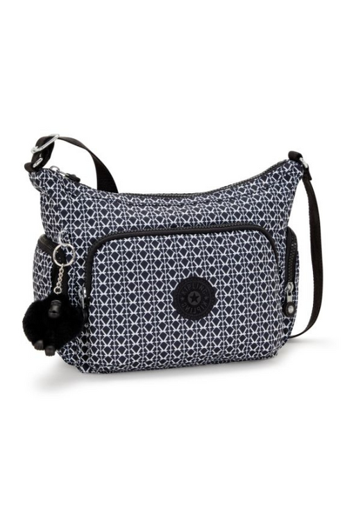 Kipling Gabb S Medium Crossbody Bag. A crossbody bag with adjustable strap, zip closure, multiple compartments, Kipling monkey charm, and all over black and white print.