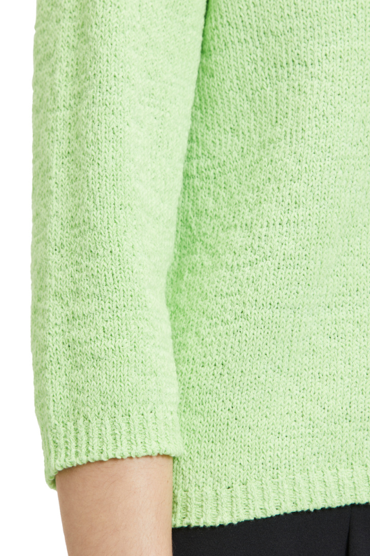 An image of a female model wearing the Betty Barclay Chunky Knit Jumper in the colour Jade Lime.