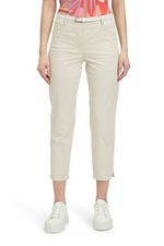An image of a model wearing the Betty Barclay Slim Fit Trousers in the colour Powder Sand.
