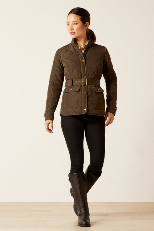 An image of a female model wearing the Ariat Woodside Jacket in the colour Earth.
