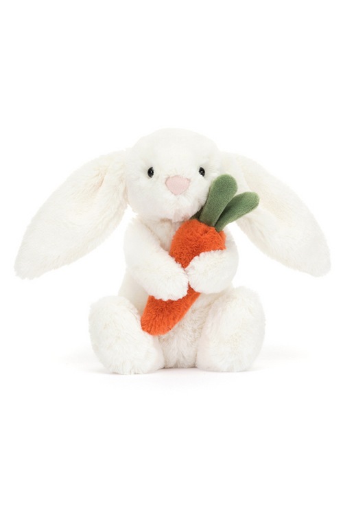 Jellycat Bashful Bunny With Carrot Little. A soft toy white bunny holding an orange tufty carrot.