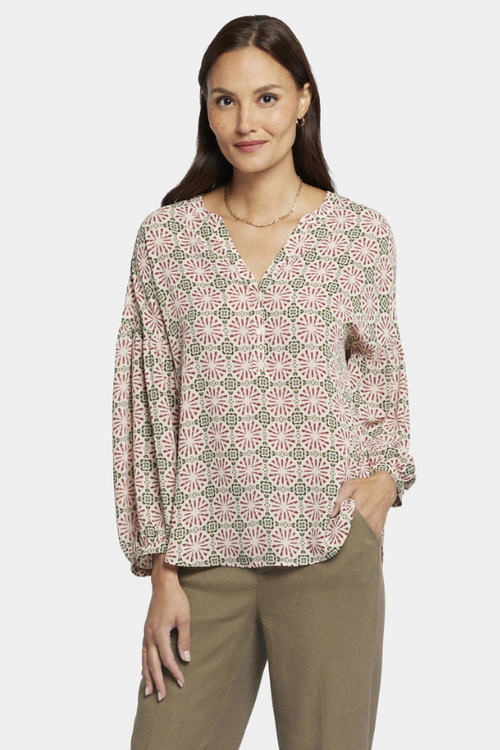 An image of a female model wearing the NYDJ Paulina Peasant Blouse in the colour Green Multi.