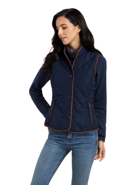An image of a female model wearing the Ariat Woodside 2.0 Quilted Gilet in the colour Navy.