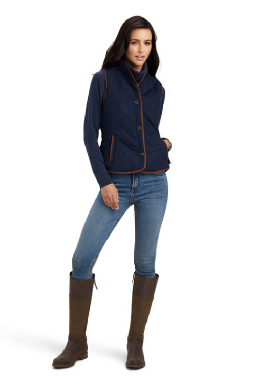 An image of a female model wearing the Ariat Woodside 2.0 Quilted Gilet in the colour Navy.