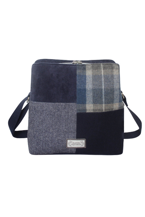 Earth Squared Logan Bag. A crossbody bag with adjustable strap, multiple compartments and magnetic/zip closures. This bag has a patchwork tweed design in the style Humble Blue