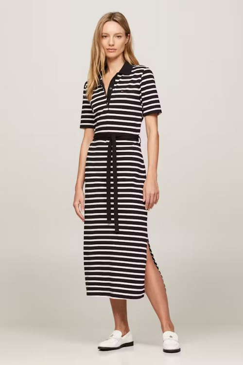 An image of a female model wearing the Tommy Hilfiger Breton Stripe Midi Polo Dress in the colour Black/Calico.