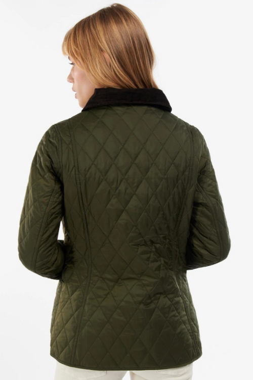 An image of a female model wearing the Barbour Annandale Quilted Jacket in the colour Olive.