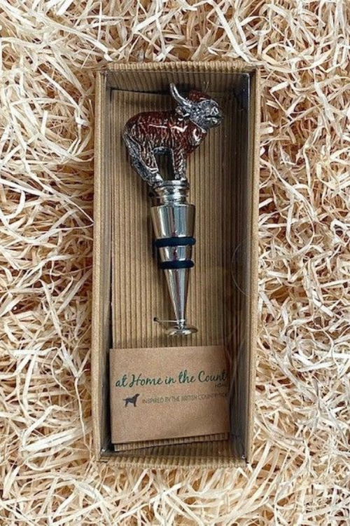An image of the Orchid Designs Enamel Highland Cow Bottle Stopper.