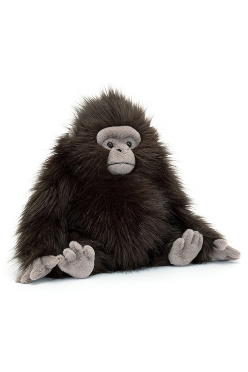 Jellycat Gomez Gorilla. A soft toy gorilla with fluffy dark fur, suedette hand and feet, and grumpy face.