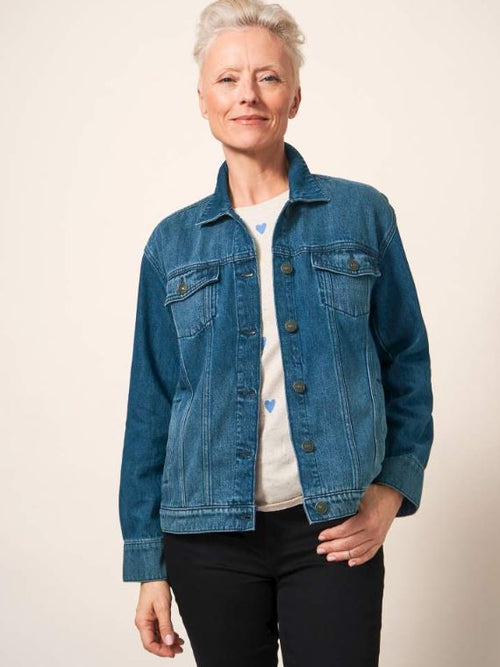 White Stuff Dayton Denim Cotton Jacket. A women's denim jacket in a classic fit with a collar, button fastening, and a timeless blue denim finish.