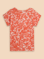 White Stuff Nelly Notch Neck Tee. A regular fit T-shirt with short sleeves, notch neck detail and eye-catching orange print.