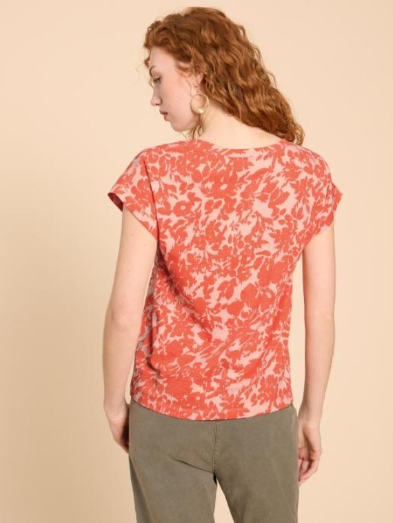 Marc Cain Short Sleeve V-Neck Top. A loose cut T-shirt with short sleeves, V-neck, and side slits, in an eye-catching orange print.