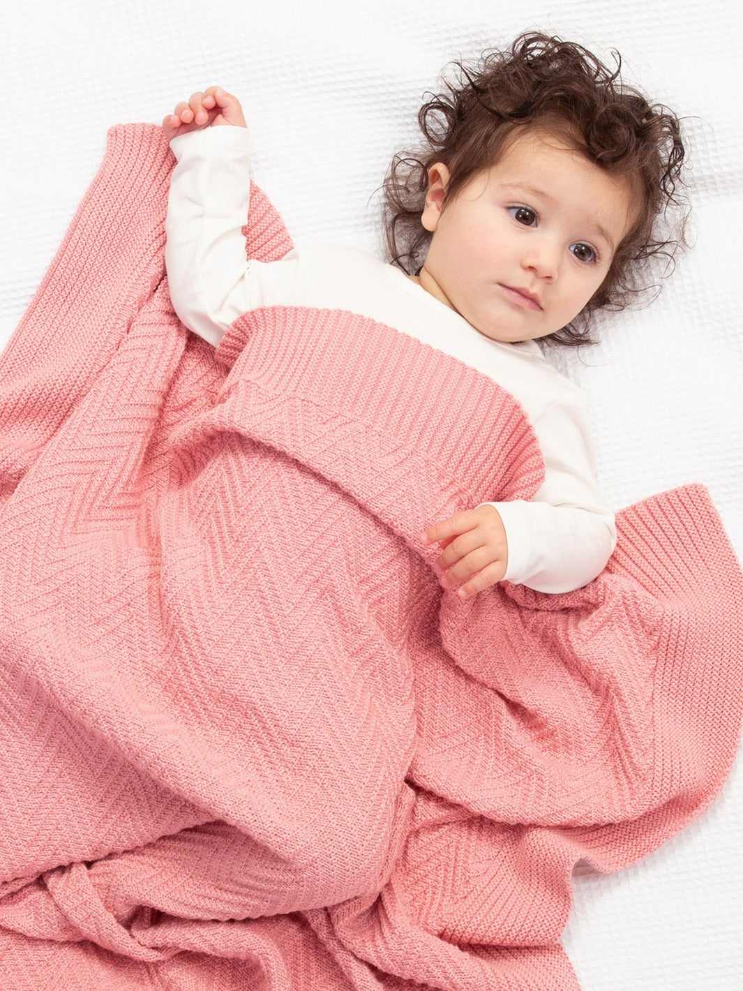 An image of the Kite Heirloom Knit Blanket Dusky Pink