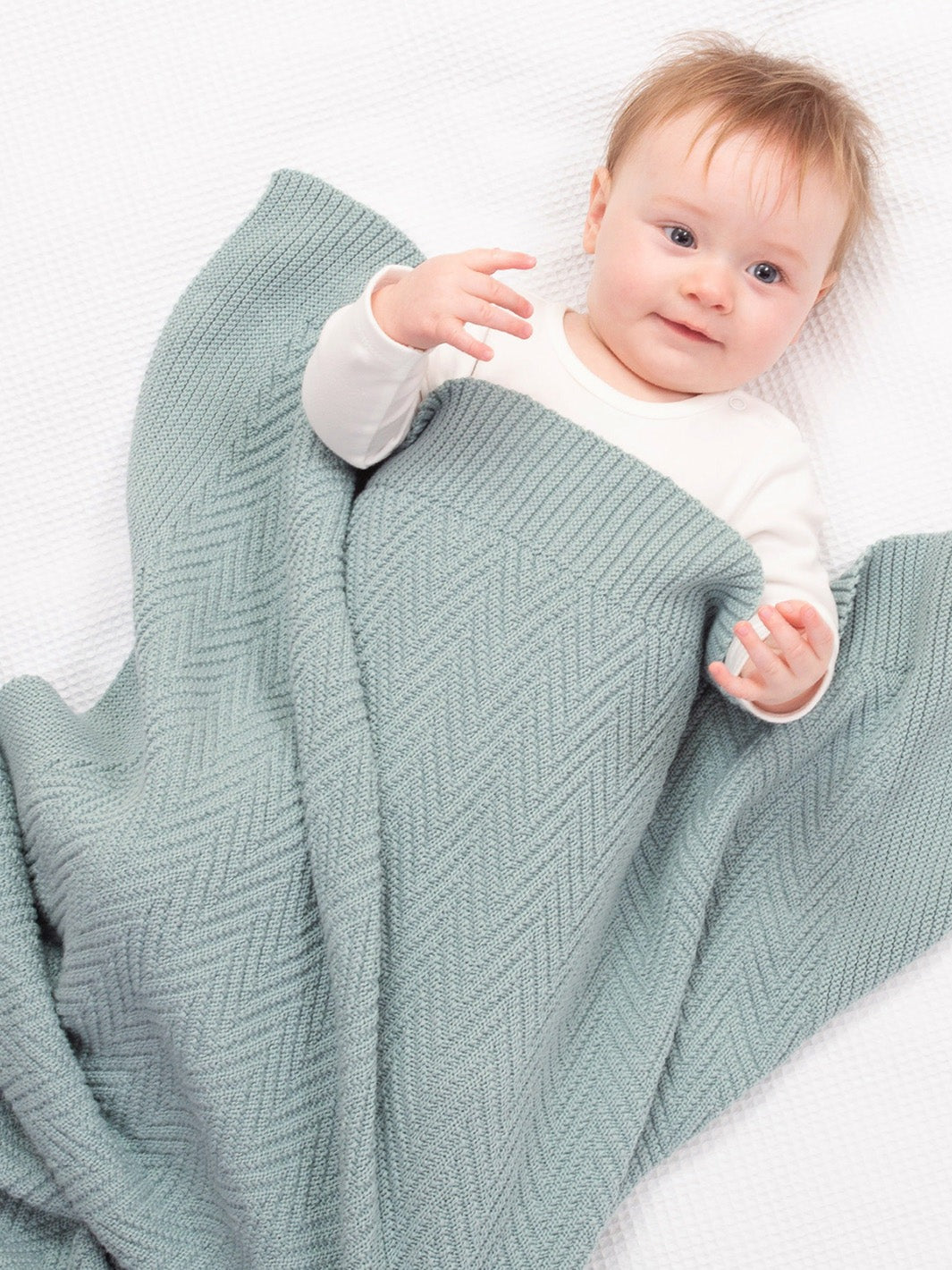 An image of the Kite Heirloom Knit Blanket Soft Thyme