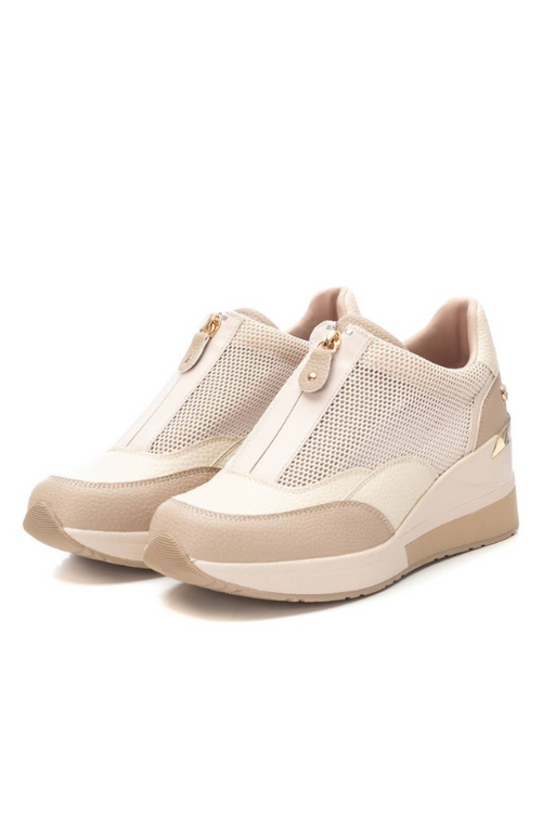 Xti Wedged Trainer. A women's trainer with mesh detail, metal zip closure, 7cm wedge and a non-slip rubber sole.