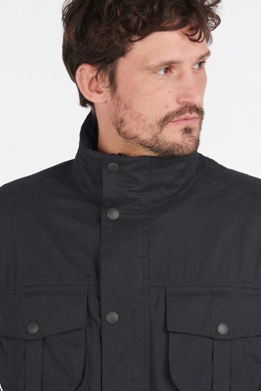 An image of a male model wearing the Barbour Sanderling Casual Jacket in the colour Navy.