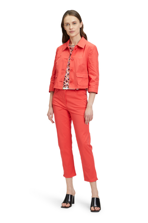 An image of a model wearing the Betty Barclay Slim Fit Trousers in the colour Cayenne.