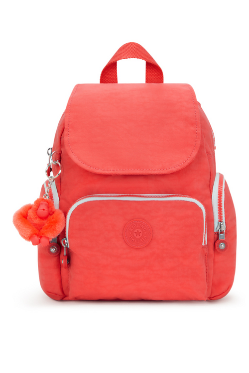 Kipling City Zip Mini Backpack with Adjustable Straps. A mini backpack with adjustable straps, zip/magnetic closure, interior and exterior pockets, Kipling logo and monkey chain. This backpack is in the colour Almost Coral. 
