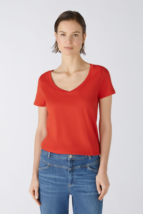 Oui V-Neck Tee Top. A straight shape top with short sleeves and deep V-neck in an orange shade. The Oui logo on the hem adds extra detail.