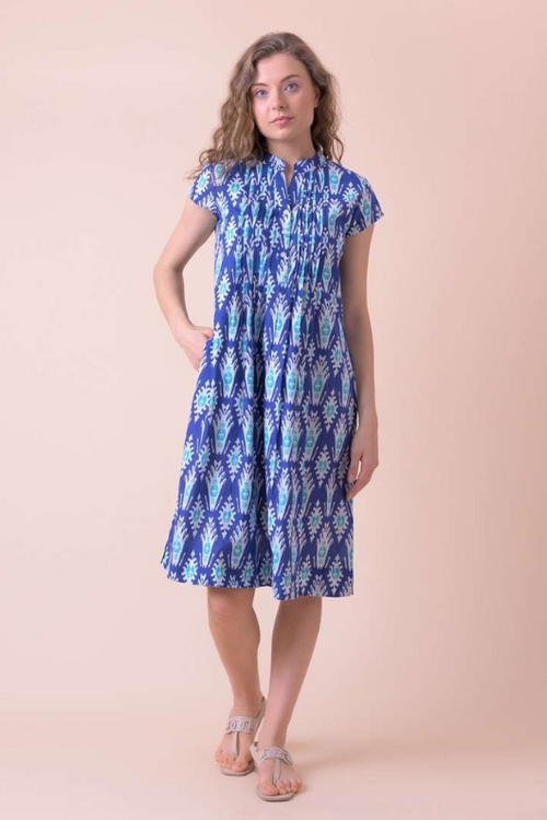 An image of a female model wearing the Handprint Dream Apparel Lacey Dress in the colour Farsi Blue.