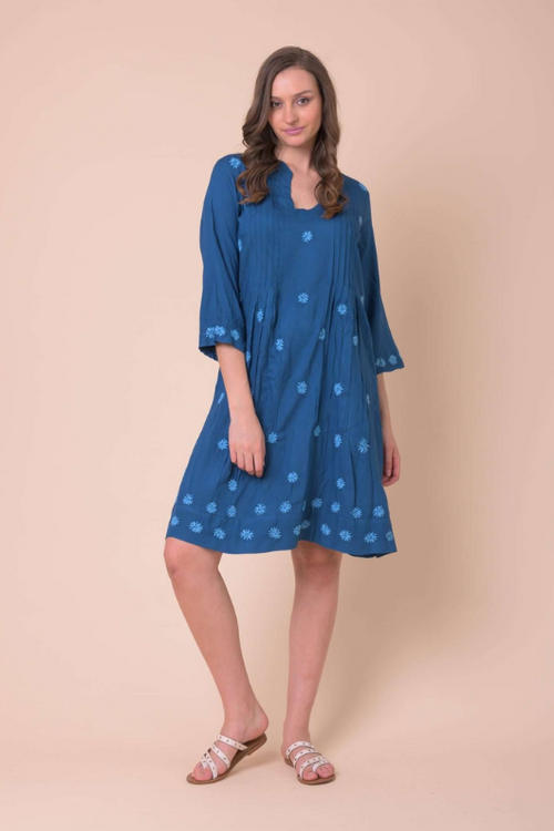 An image of a female model wearing the Handprint Dream Apparel Huckley Tunic Dress in the colour Teal.