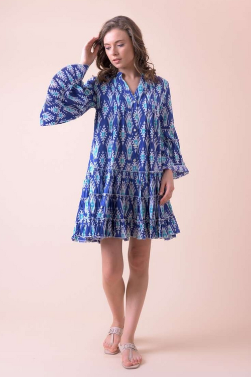 An image of a female model wearing the Handprint Dream Apparel Gretchen Dress in the colour Farsi Blue.