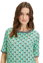 Betty Barclay Short Sleeve Pattern Top. A figure-skimming top with mid-length sleeves, a bateau neckline and an eye-catching graphic print.