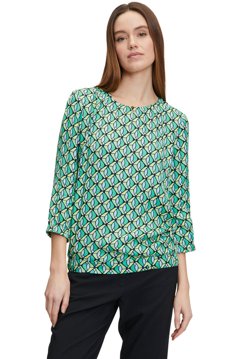 Betty Barclay 3/4 Sleeve Pattern Top. A figure-skimming top with a round neckline, an elasticated waist, and a geometrical print.