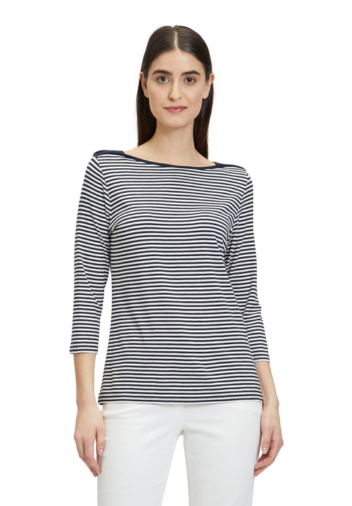 This Betty Barclay Striped Top has a bateau neckline and 3/4 length sleeves. This top is slightly fitted and has a dark blue and white striped pattern.