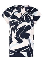Betty Barclay Cap Sleeve Top. A casual fit top with short sleeves, and a round neckline with gathered detail. This dress features an abstract design of pastel blue and pink on a navy background.
