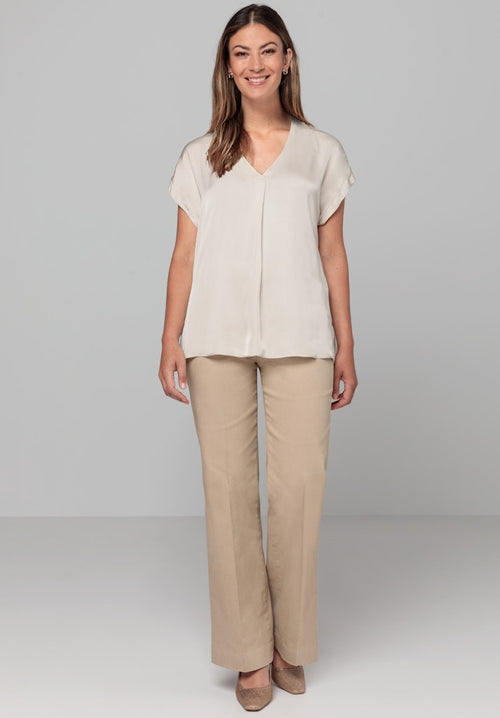 Bianca Samira Satin Top. A regular fit V-neck t-shirt with short sleeves and front pleat. Plain, sand coloured design.
