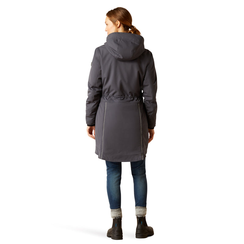 An image of a female model wearing the Ariat Tempest Waterproof Insulated Parka in the colour Ebony.