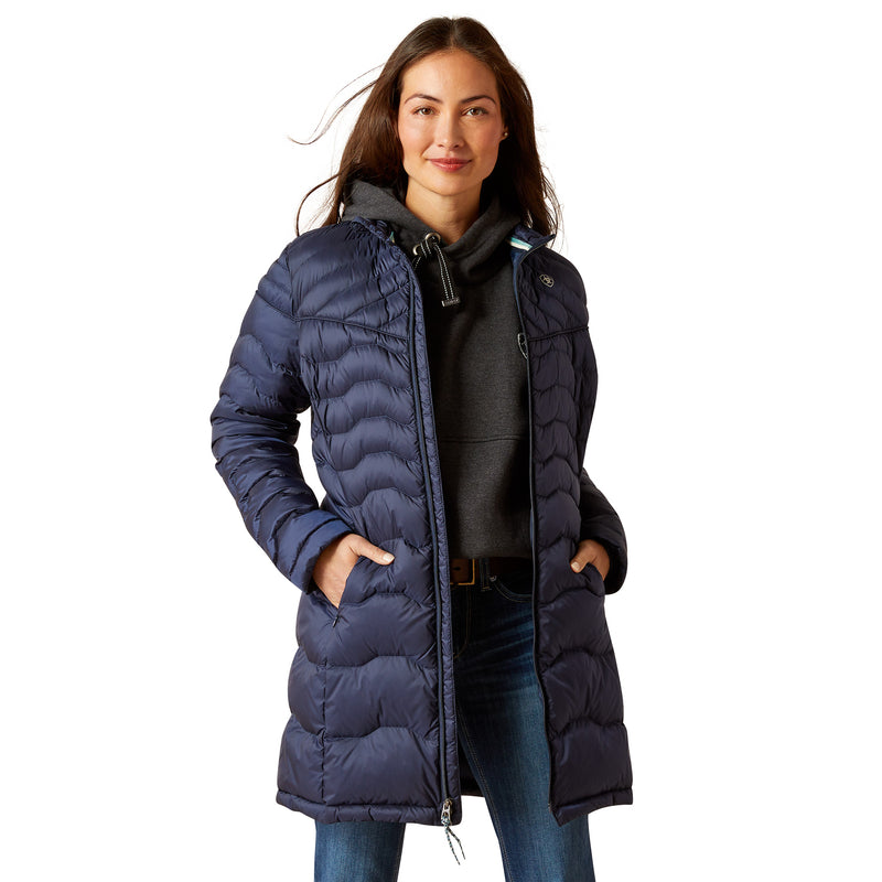 An image of a female model wearing the Ariat Ideal Down Coat in the colour Navy.