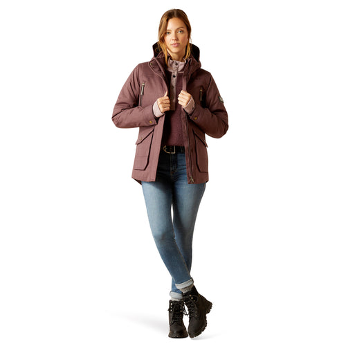 An image of a female model wearing the Ariat Sterling Waterproof Insulated Parka in the colour Raisin Pink.