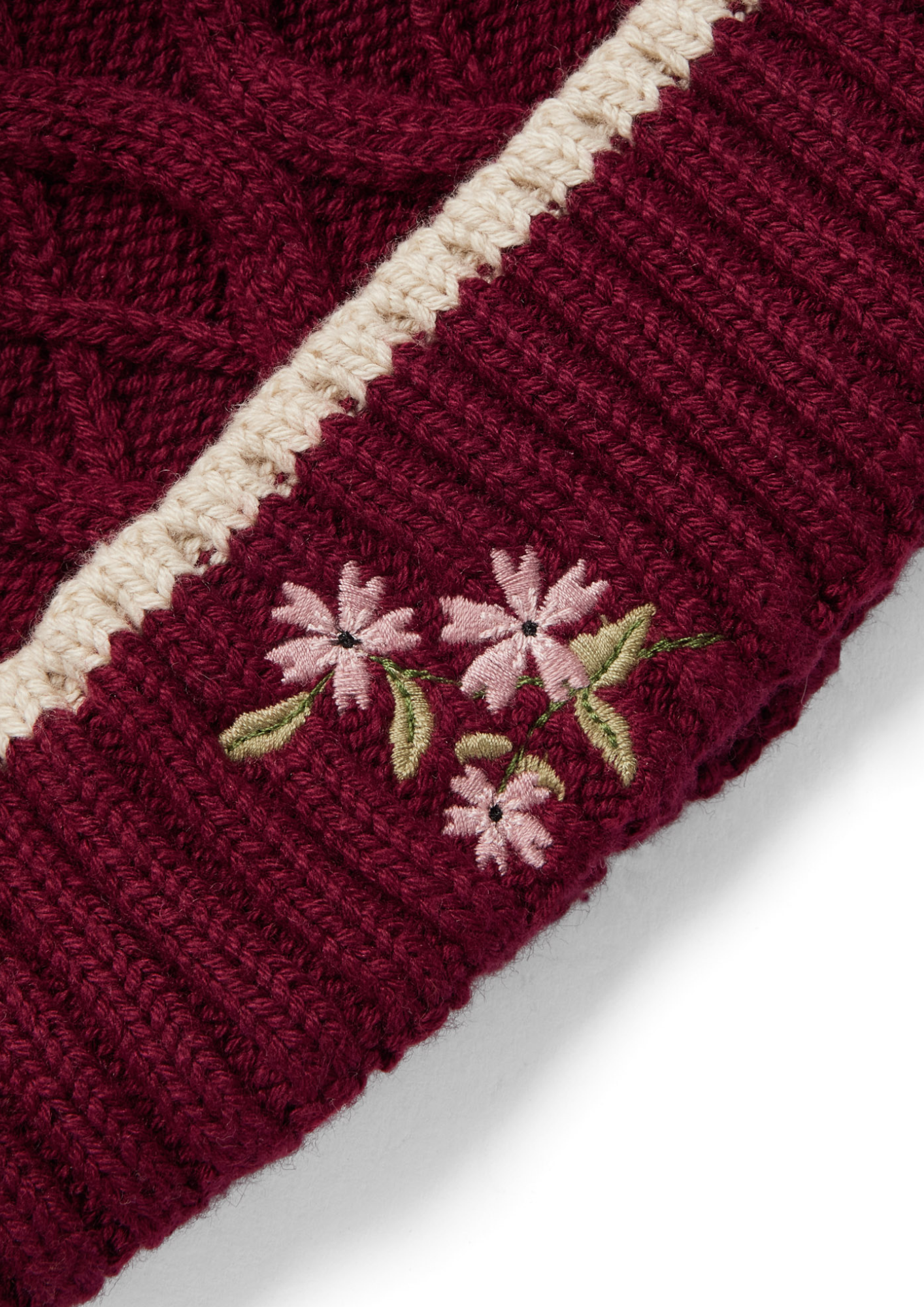 An image of the Eleanor Charles Horseshoe Floral Knit Hat