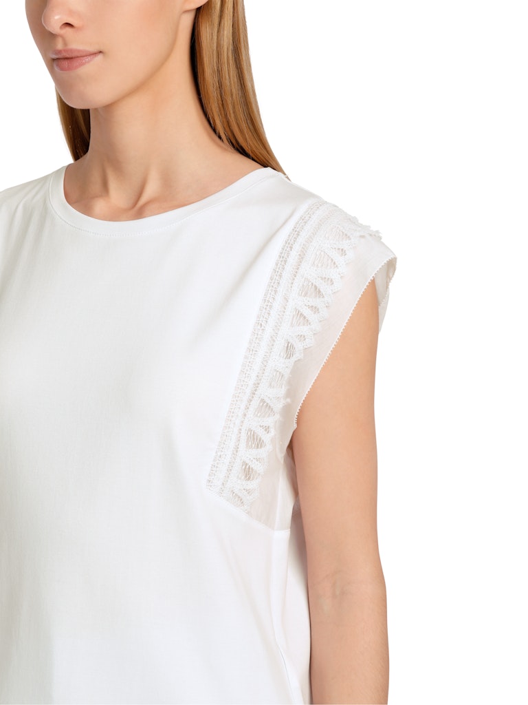 Marc Cain Cap Sleeve Lace Top. A white sleeveless, slim, and straight fit top with a round neckline and lace shoulder detail.