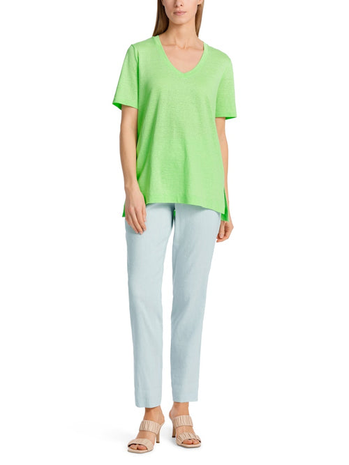 Marc Cain Short Sleeve V-Neck Top. A loose cut T-shirt with short sleeves, V-neck, and side slits, in an eye-catching green colour.