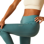 An image of a female model wearing the Ariat Tek Tight in the colour North Atlantic.