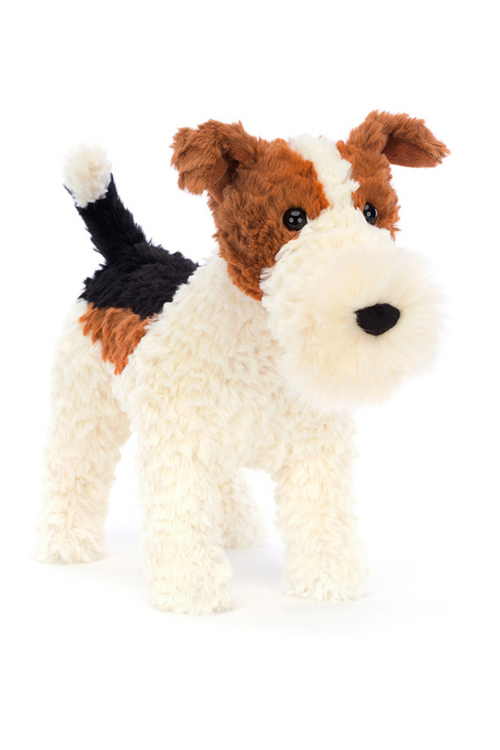 Jellycat Hector Fox Terrier. A cuddly, scruffy soft toy dog with brown, black and white fur and a fluffy snout.