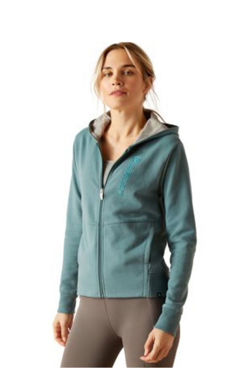 Ariat Team Logo Hood Jacket. A hooded jacket with full zip, pockets, and Ariat branding, in the colour North Atlantic.