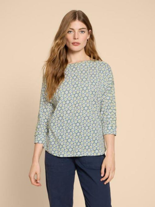 White Stuff Winnie Jersey Top. A boat neck top with 3/4 length sleeves and an all-over navy and green dotted design.