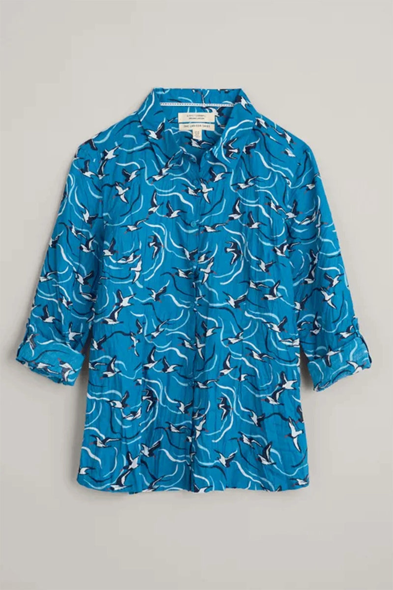 Seasalt Larissa Shirt. A semi-fitted shirt with long sleeves, collared neckline, button fastening, and bold blue bird print.