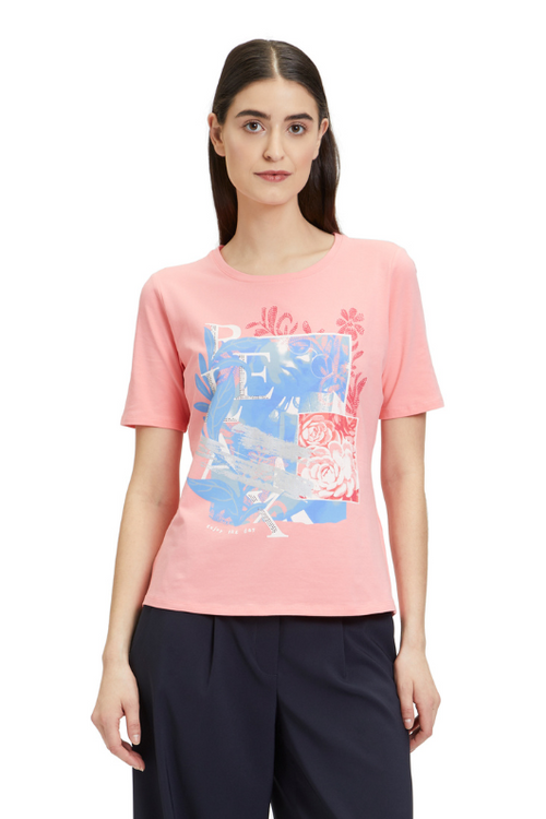 An image of a female model wearing the Betty Barclay Basic T-Shirt in the colour Patch Rose/Blue.