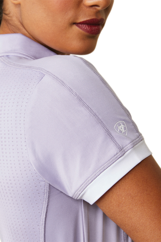 An image of a female model wearing the Ariat Bandera 1/4 Zip Short Sleeved Polo Shirt in the colour Lilac.