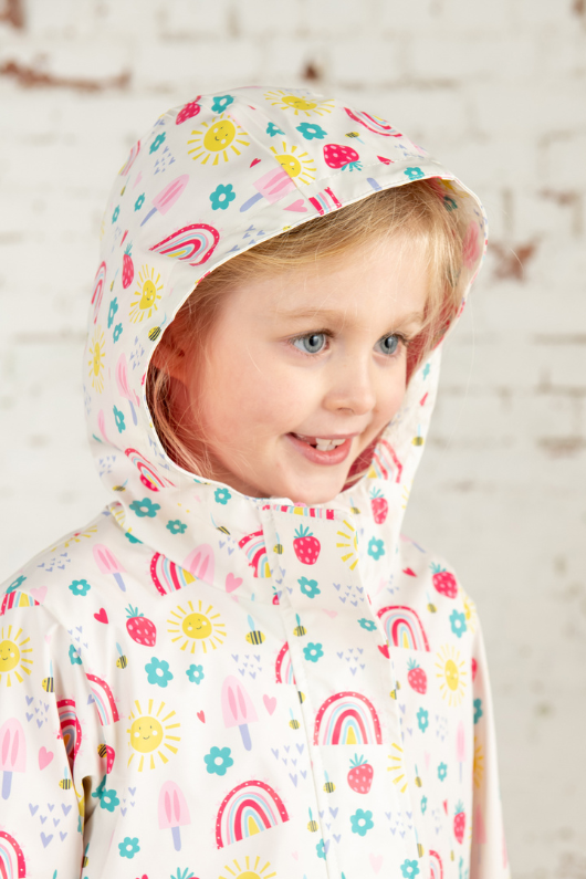 Lighthouse Heidi Jacket. A kids, waterproof coat with a soft jersey lining, and a sweet rainbows & sunshine design on a white background.