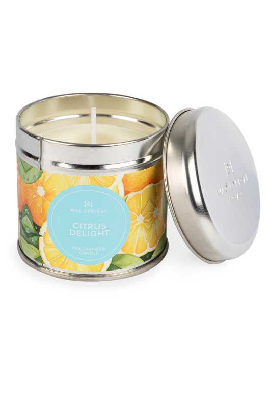 A candle with tin packaging and citrus label, with notes of orange, grapefruit, lemon, mandarin, jasmine, and neroli.
