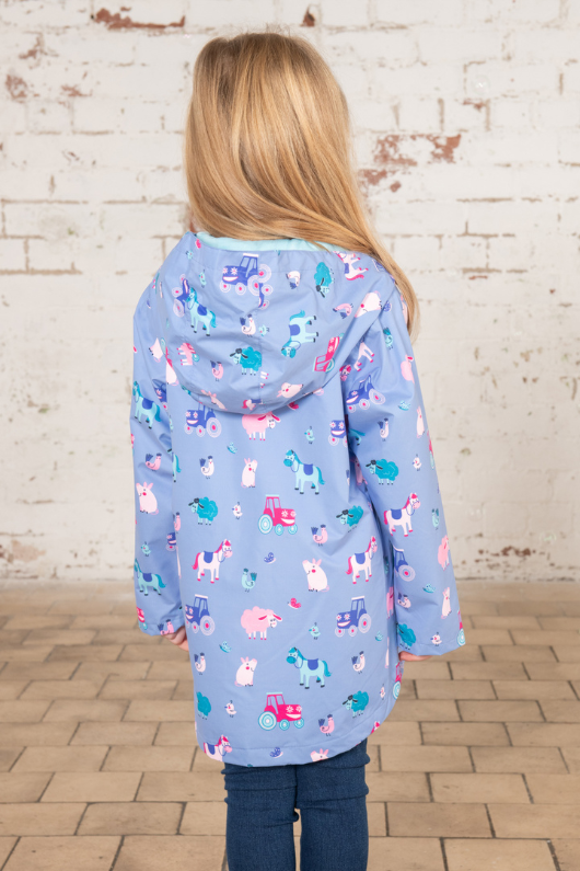 Lighthouse Olivia Jacket. A lightweight, waterproof kids coat with a soft jersey lining, two front pockets, a zip-up front, and a cute farm animal design on a lilac background.