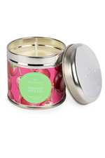 A candle with tin packaging and cherry label, with notes of cherry, pear, raspberry, and vanilla.